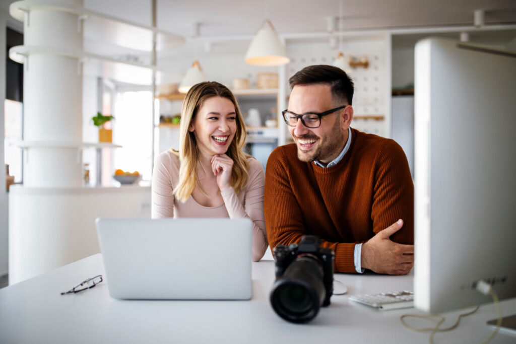 Graphic designers working in office with laptop te 83A2Y7N.jpg